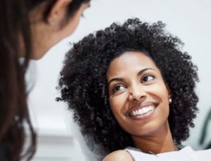 Woman smiling looking at someone