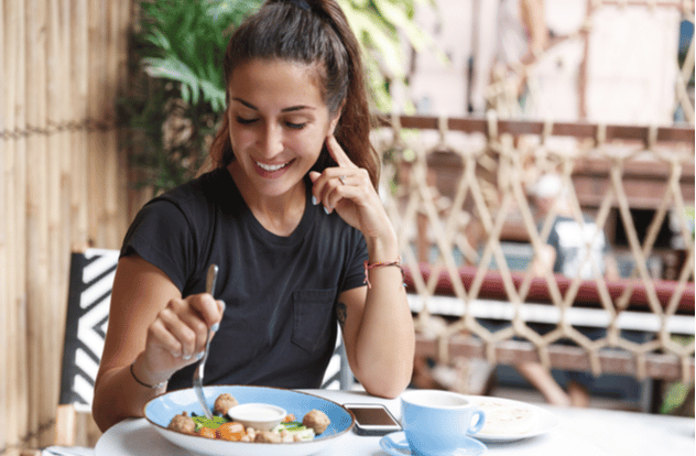 woman eating at restaurant table healthy food,
