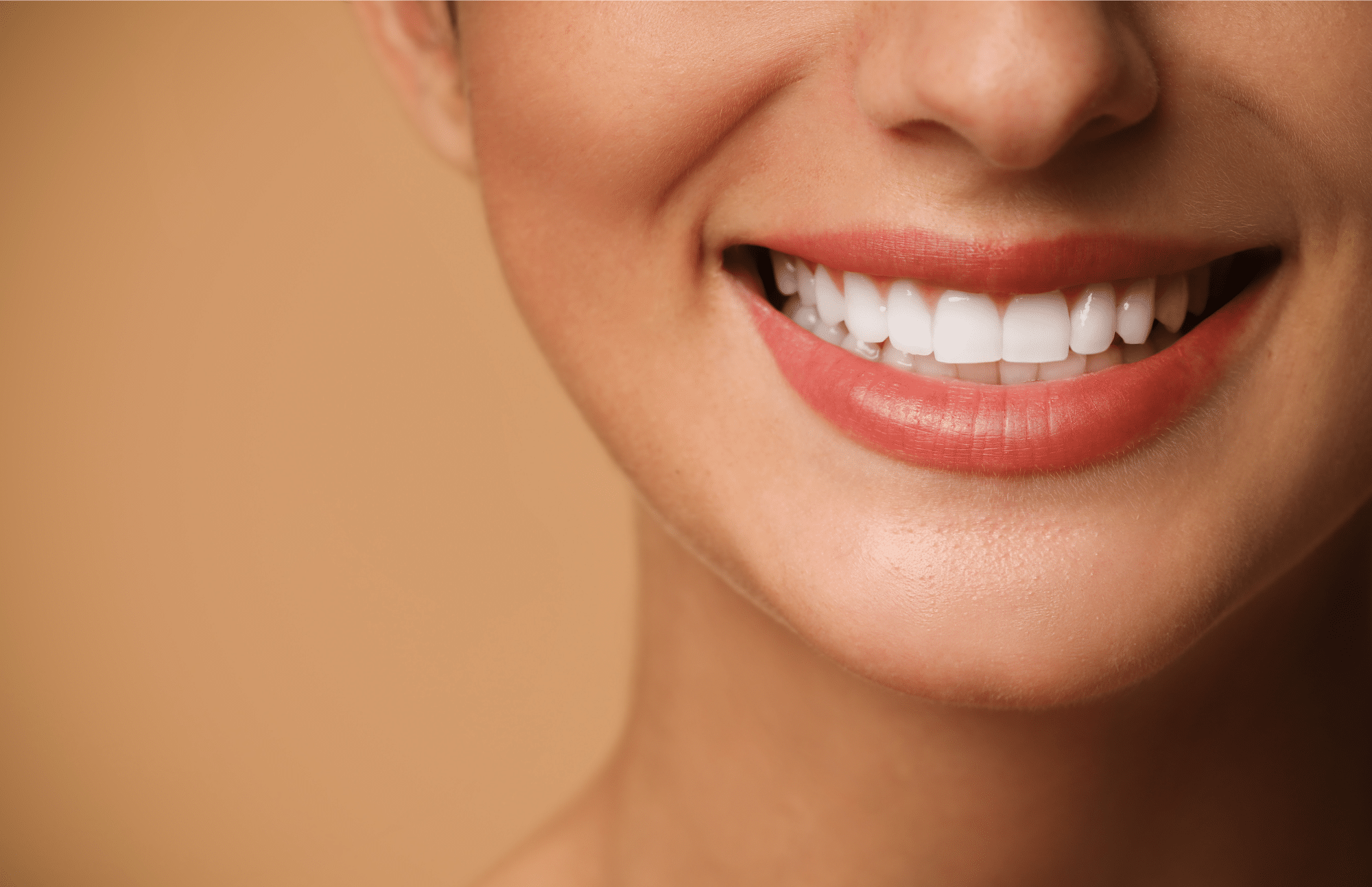 confidently smiling woman with her nwe porcelain veneers made at Pacific Northwest Smiles at Mill Creek