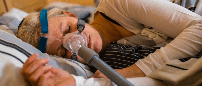Patient having a fitful, terrible sleep due to sleep apnea and CPAP machine